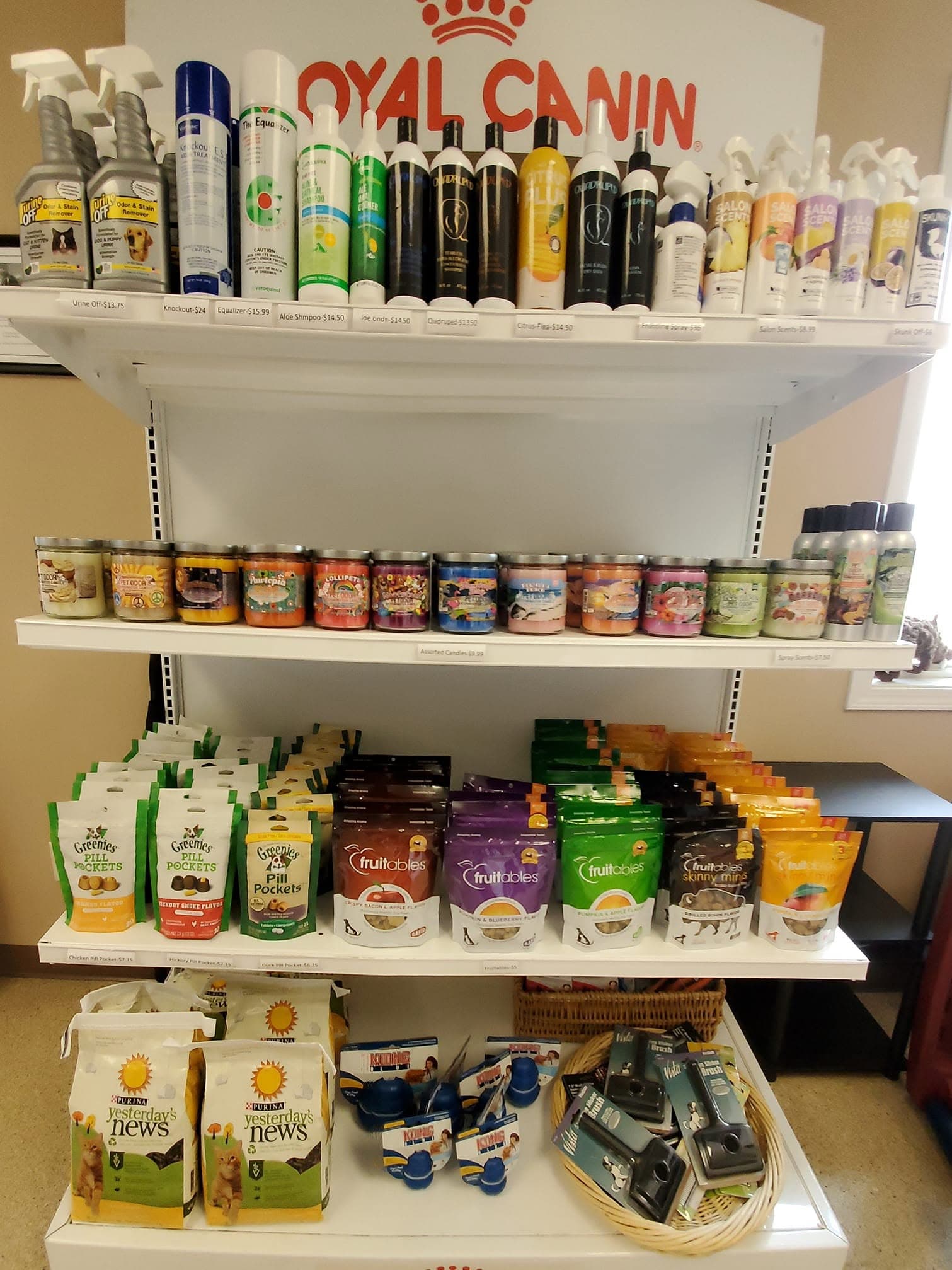 The retail wall: shampoos, treats, and litter, all priced